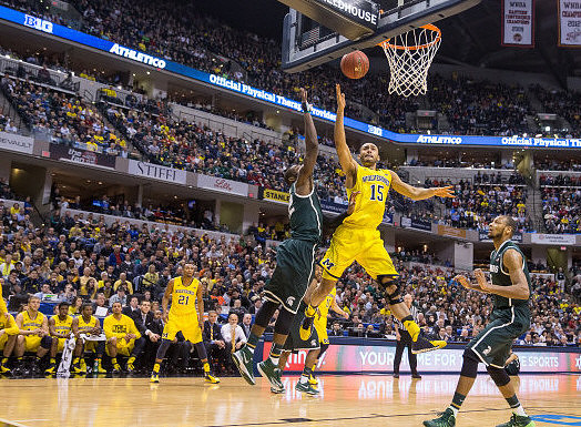 Zak Irvin (21) and Jon Horford (15)