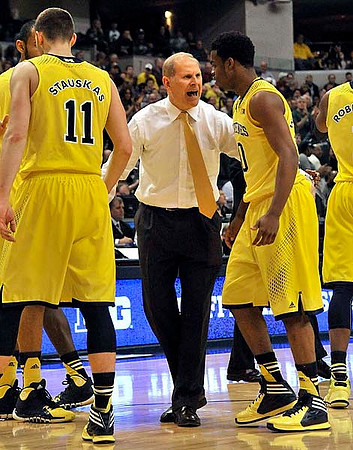 Nik Stauskas (11), John Beilein, Derrick Walton Jr. (10), and Glenn Robinson III (1)