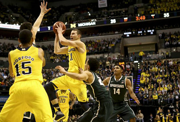 Jon Horford (15), Glenn Robinson III (1), and Derrick Walton Jr. (10)