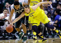 Nik Stauskas (11) and Zak Irvin (21)