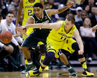 Nik Stauskas (11) and Zak Irvin (21)