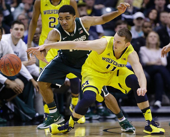 Nik Stauskas (11) and Zak Irvin (21)