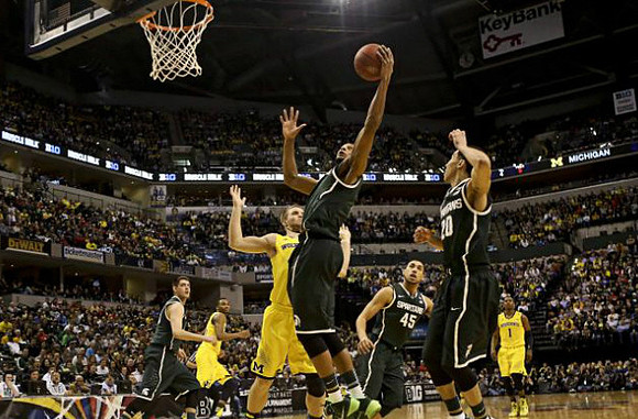 Zak Irvin (21), Max Bielfeldt (44), and Glenn Robinson III (1)