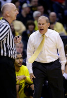 Jon Horford (15) and John Beilein