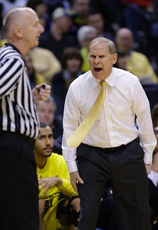 Jon Horford (15) and John Beilein