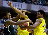 Jon Horford (15) and Derrick Walton Jr. (10)