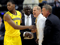 Glenn Robinson III (1), Bacari Alexander, John Beilein, and Jeff Meyer