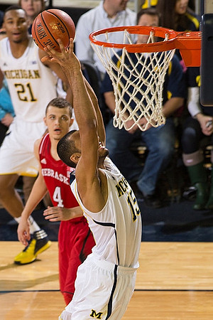 Zak Irvin (21) and Jon Horford (15)