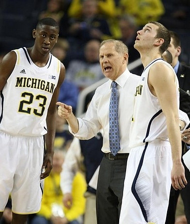 Caris LeVert (23), John Beilein, and Nik Stauskas (11)