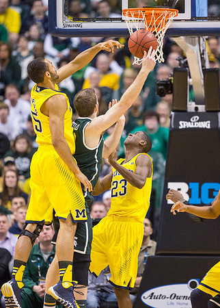 Jon Horford (15) and Caris LeVert (23)