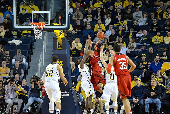 Jordan Morgan (52), Caris LeVert (23), and Nik Stauskas (11)