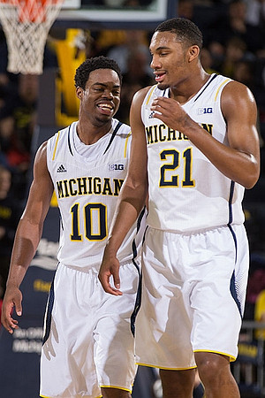 Derrick Walton Jr. (10) and Zak Irvin (21)