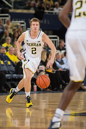 Spike Albrecht (2) and Caris LeVert (23)