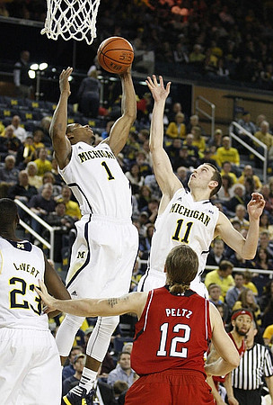 Caris LeVert (23), Glenn Robinson III (1), and Nik Stauskas (11)