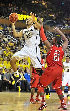 Jon Horford (15) and Derrick Walton Jr. (10)