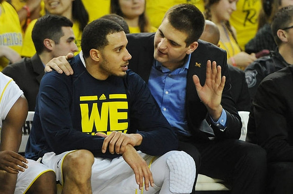Jordan Morgan (52) and Mitch McGary (4)