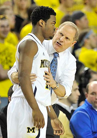 Derrick Walton Jr. (10) and John Beilein