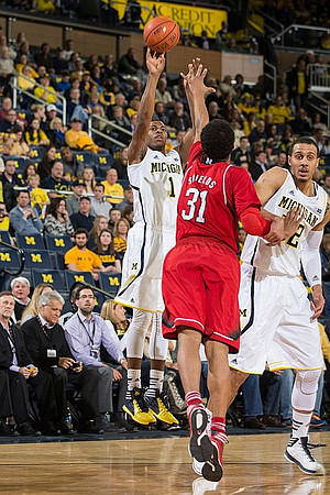Glenn Robinson III (1) and Jordan Morgan (52)