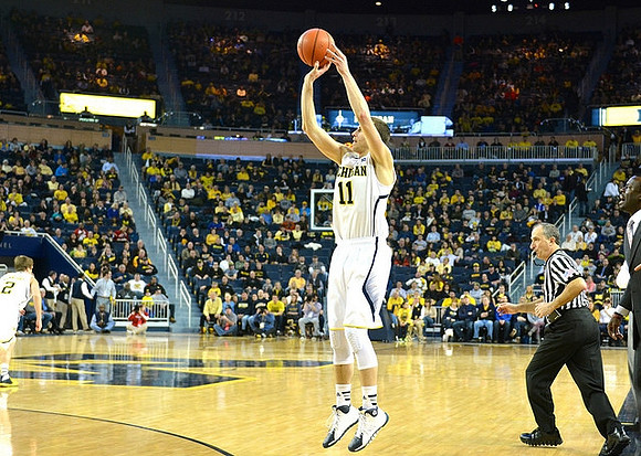 Nik Stauskas (11) and Spike Albrecht (2)