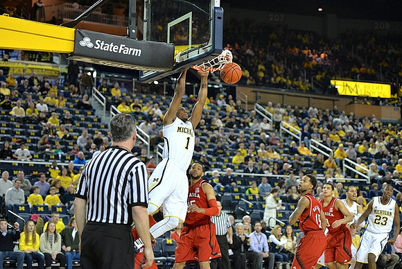 Glenn Robinson III (1), Caris LeVert (23), and Jordan Morgan (52)