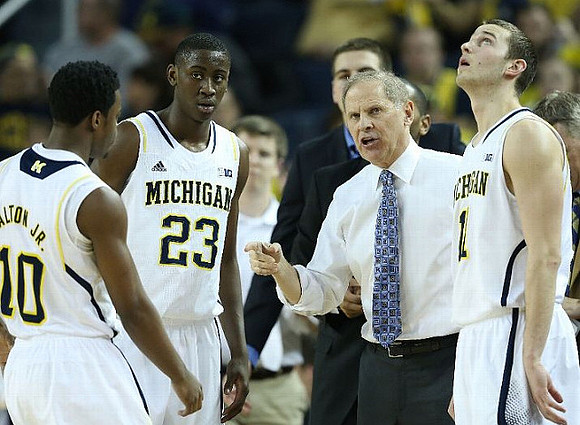 Derrick Walton Jr. (10), Caris LeVert (23), John Beilein, and Nik Stauskas (11)