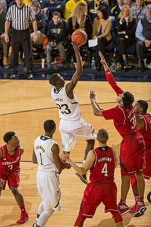 Glenn Robinson III (1) and Caris LeVert (23)