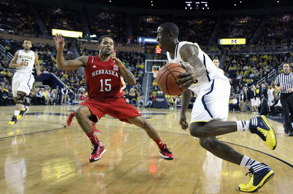 Jon Horford (15) and Caris LeVert (23)