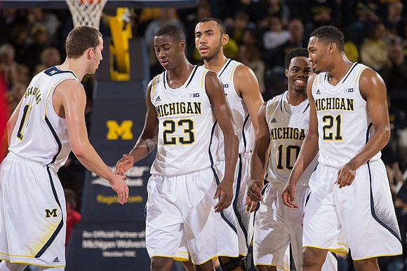 Nik Stauskas (11), Caris LeVert (23), Jon Horford (15), Derrick Walton Jr. (10), and Zak Irvin (21)