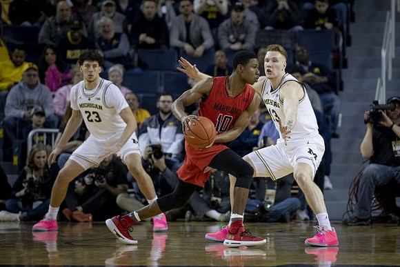 Brandon Johns Jr. (23) and Ignas Brazdeikis (13)