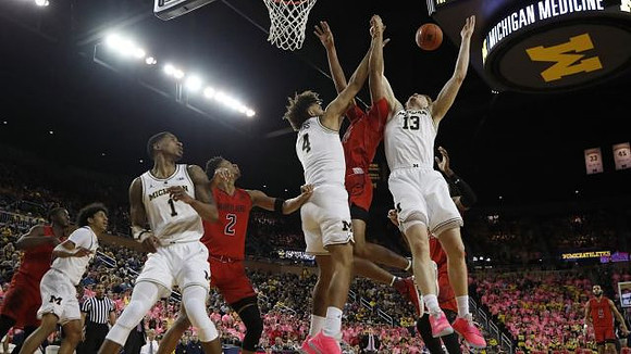 Eli Brooks (55), Charles Matthews (1), Isaiah Livers (4), and Ignas Brazdeikis (13)