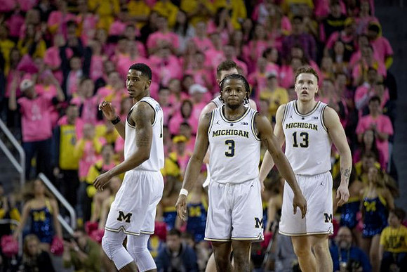 Charles Matthews (1), Zavier Simpson (3), and Ignas Brazdeikis (13)