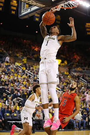 Charles Matthews (1) and Jordan Poole (2)