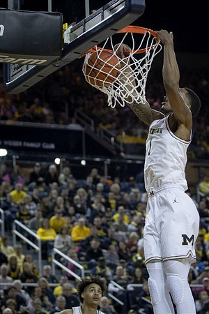 Charles Matthews (1) and Jordan Poole (2)