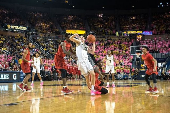 Jordan Poole (2), Ignas Brazdeikis (13), and Zavier Simpson (3)