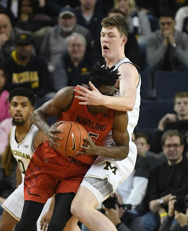 David DeJulius (0) and Jon Teske (15)