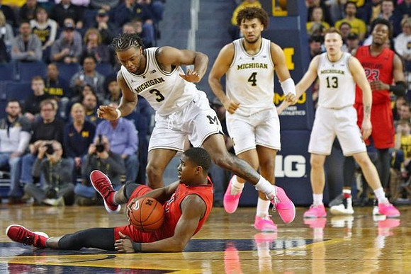 Zavier Simpson (3), Isaiah Livers (4), and Ignas Brazdeikis (13)