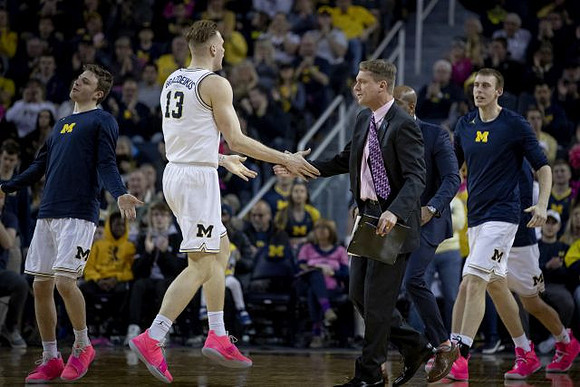 Luke Wilson (32), Ignas Brazdeikis (13), Luke Yaklich, Deandre Haynes, and Austin Davis (51)