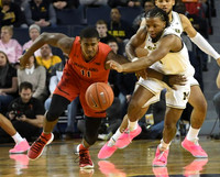 Zavier Simpson (3) and Isaiah Livers (4)