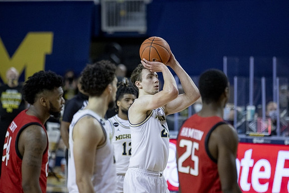 Brandon Johns Jr. (23), Franz Wagner (21), and Mike Smith (12)