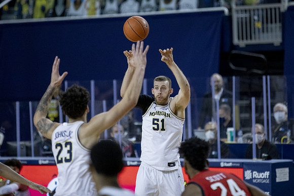 Brandon Johns Jr. (23) and Austin Davis (51)