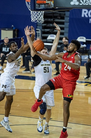 Chaundee Brown Jr. (15) and Austin Davis (51)