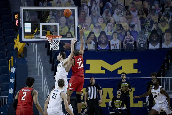 Franz Wagner (21), Hunter Dickinson (1), and Chaundee Brown Jr. (15)