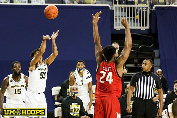 Chaundee Brown Jr. (15) and Eli Brooks (55)