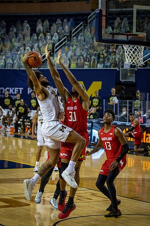 Isaiah Livers (2) and Eli Brooks (55)