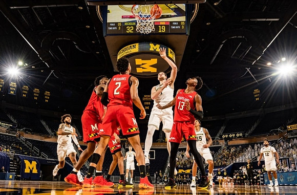 Isaiah Livers (2), Franz Wagner (21), Hunter Dickinson (1), Eli Brooks (55), and Mike Smith (12)