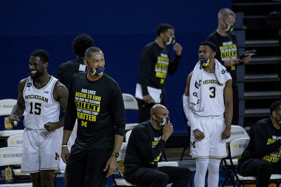 Chaundee Brown Jr. (15), Juwan Howard, Saddi Washington, and Zeb Jackson (3)
