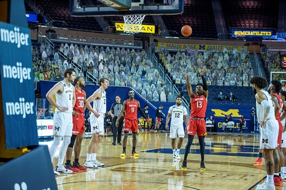 Hunter Dickinson (1), Franz Wagner (21), Mike Smith (12), and Isaiah Livers (2)