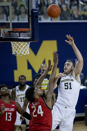 Chaundee Brown Jr. (15) and Austin Davis (51)