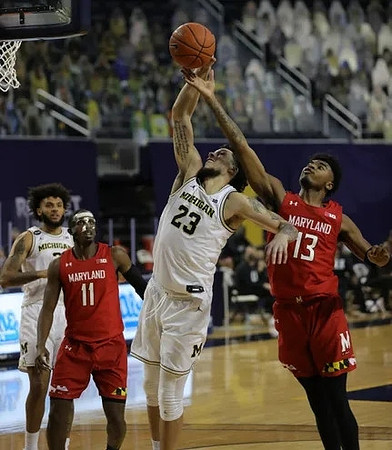 Isaiah Livers (2) and Brandon Johns Jr. (23)