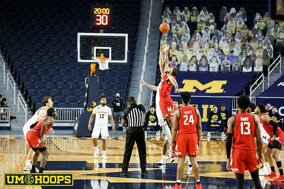 Franz Wagner (21), Mike Smith (12), Hunter Dickinson (1), Eli Brooks (55), and Isaiah Livers (2)